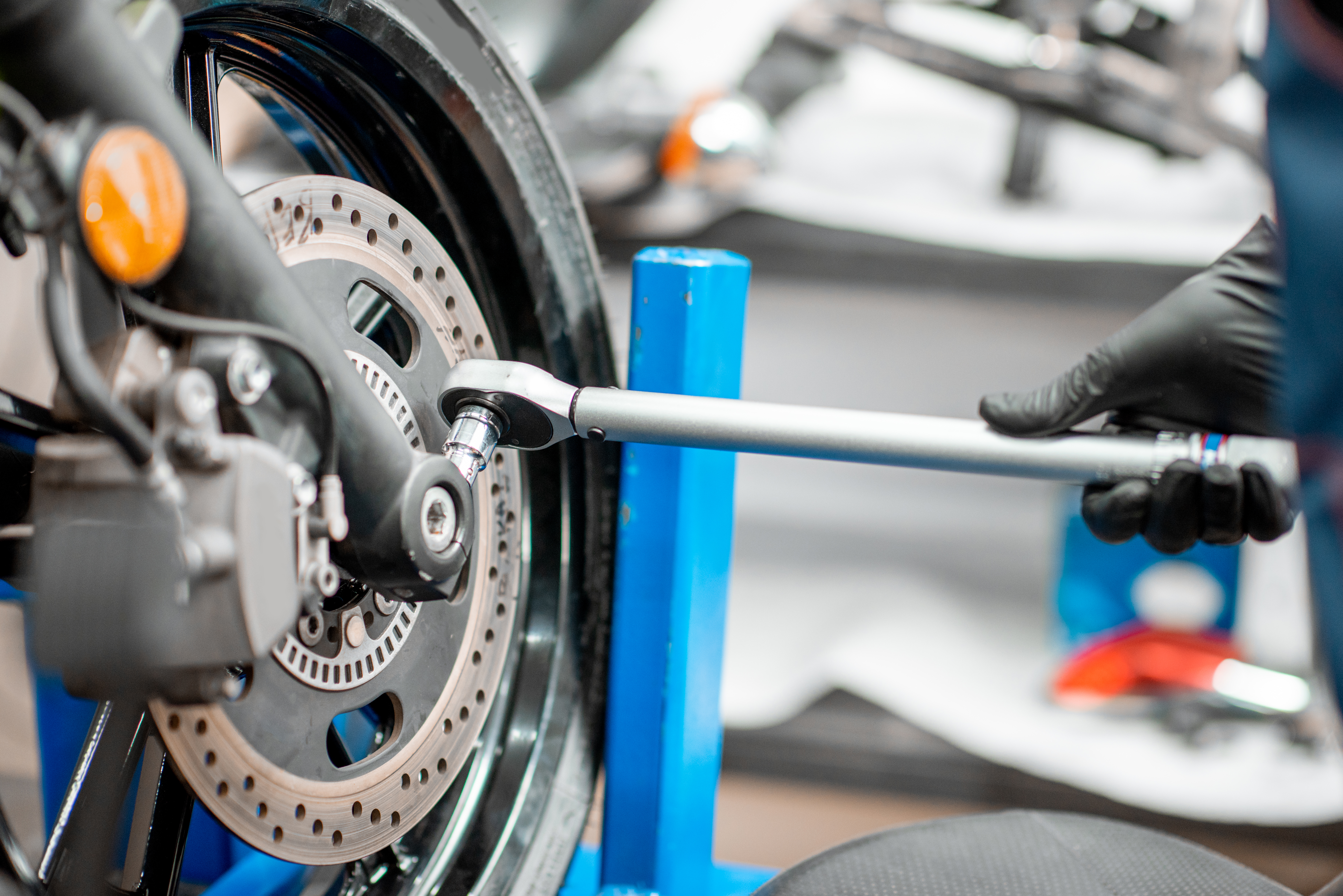 Technician servicing a motorcycle at the workshop
